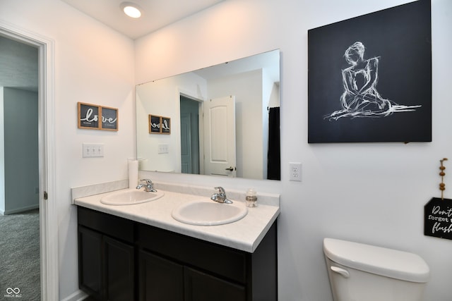6883 Honeysuckle Way, Pendleton, IN 46064 - bathroom with double vanity and toilet