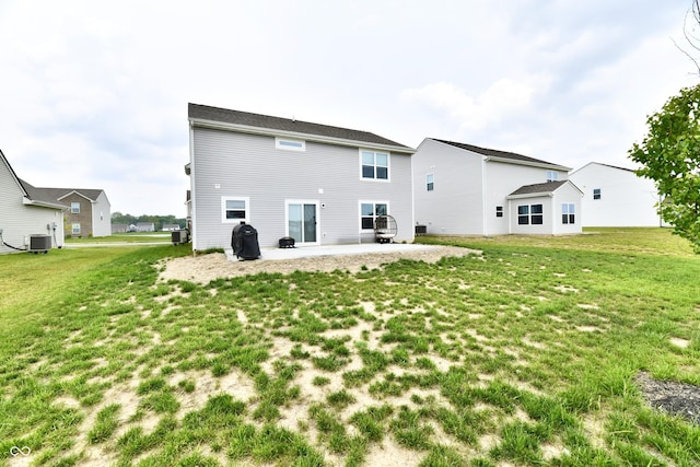 6883 Honeysuckle Way, Pendleton, IN 46064 - rear view of property with a patio, a lawn, and central air condition unit