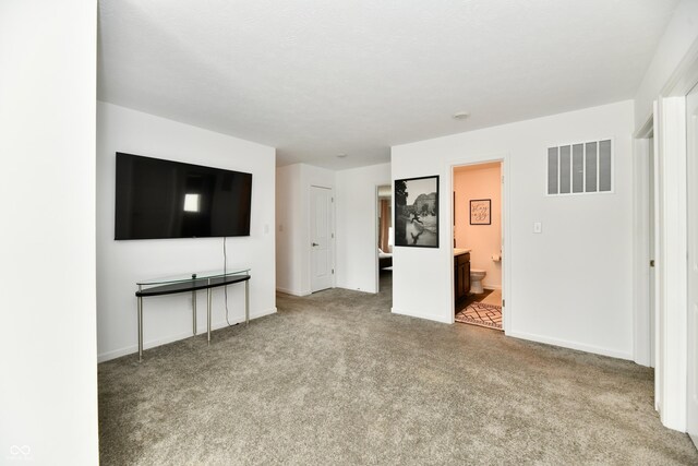 6883 Honeysuckle Way, Pendleton, IN 46064 - unfurnished living room featuring carpet and baseboards