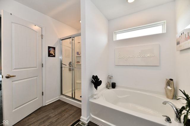 6883 Honeysuckle Way, Pendleton, IN 46064 - bathroom with a bath, wood finished floors, and a shower stall