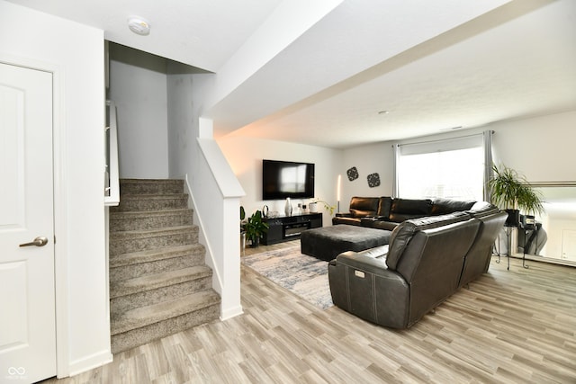 6883 Honeysuckle Way, Pendleton, IN 46064 - living room featuring light wood-type flooring and stairs