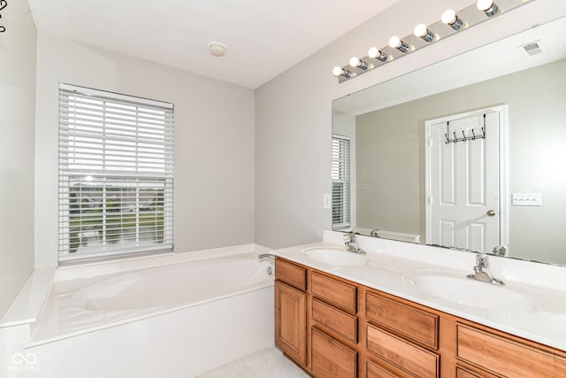 174 Straughn Ln, Westfield, IN 46074 - bathroom with double vanity, a bath, and tile patterned flooring