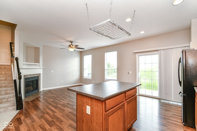 174 Straughn Ln, Westfield, IN 46074 - kitchen with dark countertops, dark wood-style flooring, plenty of natural light, freestanding refrigerator, and recessed lighting