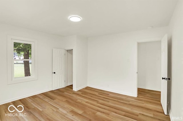 701 E Memorial Dr, Muncie, IN 47302 - empty room featuring light wood-style flooring and baseboards