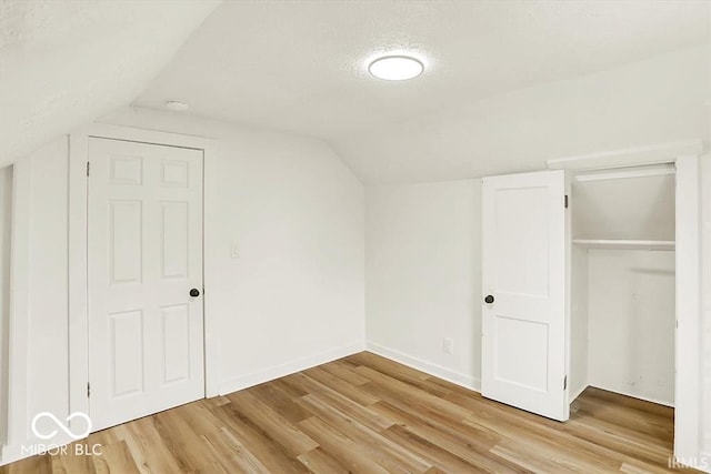 701 E Memorial Dr, Muncie, IN 47302 - bonus room with wood finished floors, lofted ceiling, and baseboards