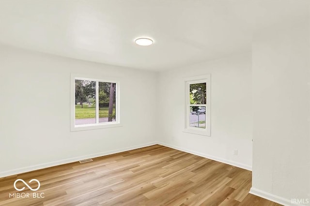 701 E Memorial Dr, Muncie, IN 47302 - spare room with light wood-style floors and baseboards
