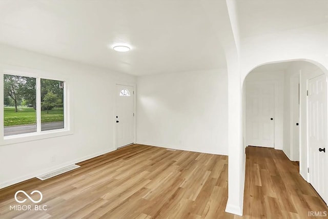 701 E Memorial Dr, Muncie, IN 47302 - entrance foyer with light wood-style floors and arched walkways