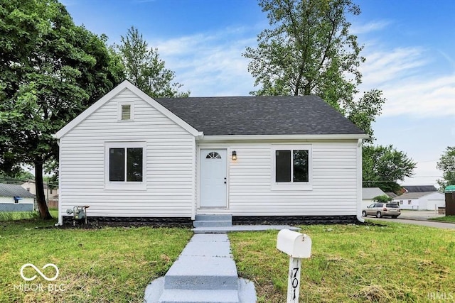 701 E Memorial Dr, Muncie, IN 47302 - view of front of home with a front lawn and roof with shingles