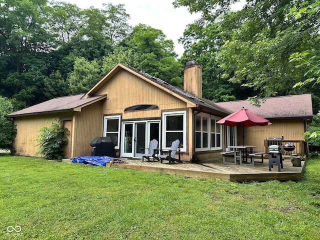 7811 N County Road 500 E, Pittsboro, IN 46167 - rear view of property with a chimney, a wooden deck, a yard, and a shingled roof