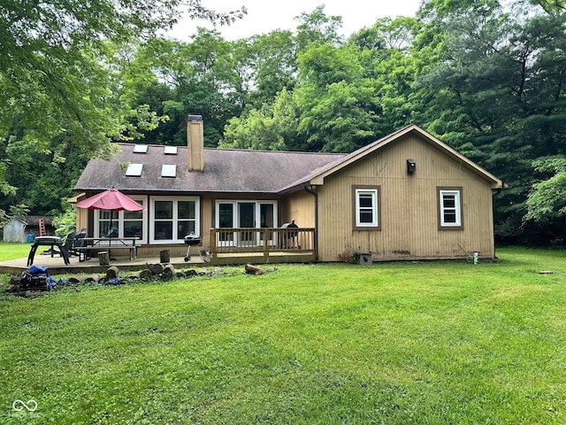 7811 N County Road 500 E, Pittsboro, IN 46167 - rear view of property with a yard, a chimney, a deck, and a shingled roof