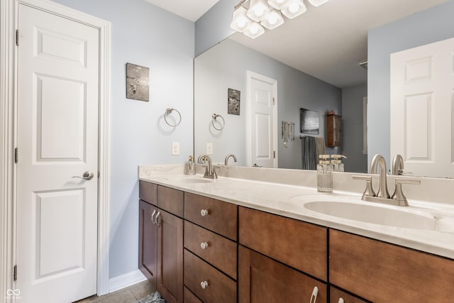 2020 N Park Ave, Indianapolis, IN 46202 - bathroom featuring double vanity, baseboards, and tile patterned floors