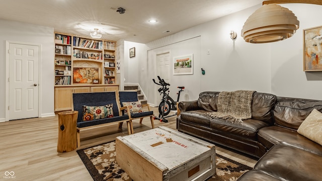 2020 N Park Ave, Indianapolis, IN 46202 - living room featuring light wood finished floors, stairway, recessed lighting, and baseboards