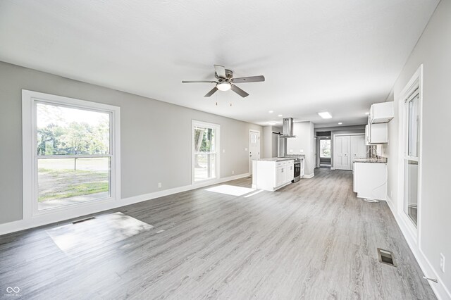 496 N County Road 325 W, Danville, IN 46122 - unfurnished living room featuring a ceiling fan, light wood-style flooring, and recessed lighting