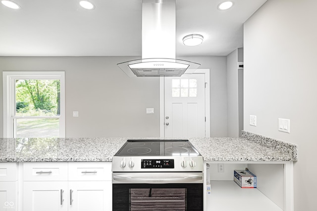 496 N County Road 325 W, Danville, IN 46122 - kitchen featuring stainless steel range with electric stovetop, island exhaust hood, white cabinetry, recessed lighting, and light stone counters