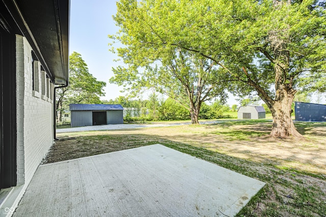 496 N County Road 325 W, Danville, IN 46122 - view of yard featuring a patio area and an outbuilding