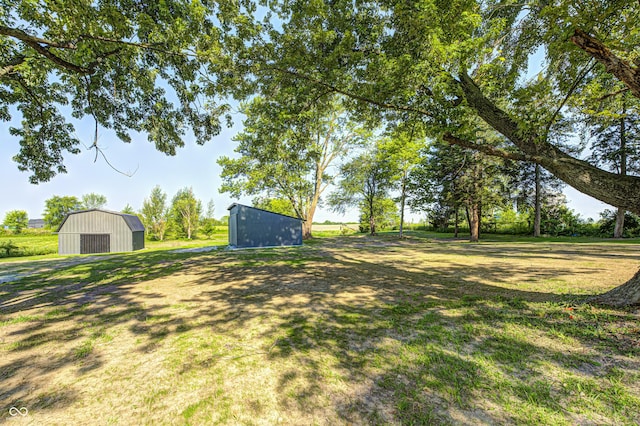 496 N County Road 325 W, Danville, IN 46122 - view of green lawn featuring a pole building, an outbuilding, and a detached garage