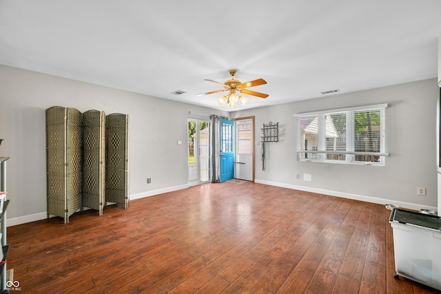 120 Hoss Rd, Indianapolis, IN 46217 - unfurnished living room with a ceiling fan, hardwood / wood-style flooring, and baseboards