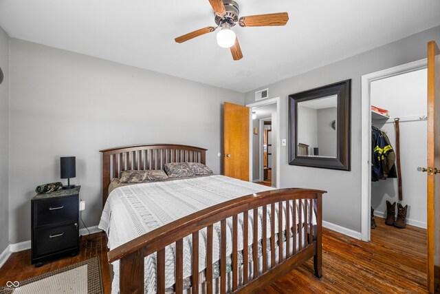 120 Hoss Rd, Indianapolis, IN 46217 - bedroom featuring hardwood / wood-style flooring, a closet, a spacious closet, and baseboards