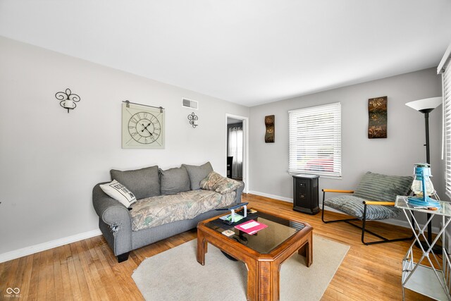 120 Hoss Rd, Indianapolis, IN 46217 - living area featuring baseboards and light wood-type flooring