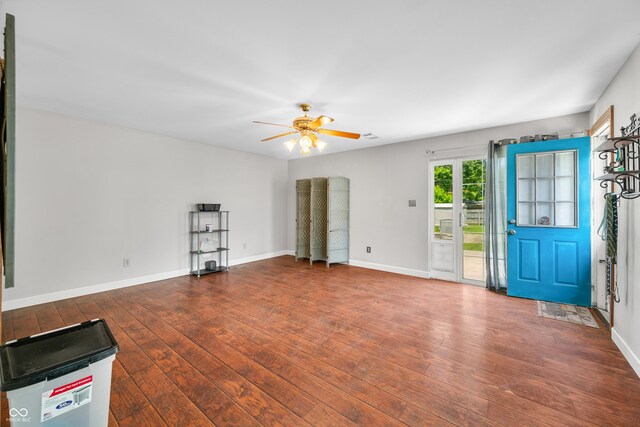 120 Hoss Rd, Indianapolis, IN 46217 - unfurnished living room featuring ceiling fan, wood-type flooring, and baseboards