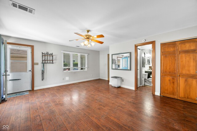 120 Hoss Rd, Indianapolis, IN 46217 - unfurnished living room featuring a ceiling fan, baseboards, and dark wood-style flooring