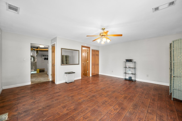 120 Hoss Rd, Indianapolis, IN 46217 - unfurnished living room with a ceiling fan, hardwood / wood-style floors, and baseboards