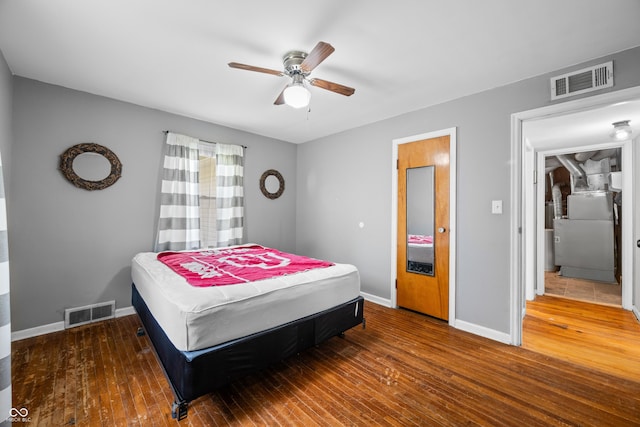 120 Hoss Rd, Indianapolis, IN 46217 - bedroom featuring baseboards, hardwood / wood-style floors, ceiling fan, and washer / clothes dryer