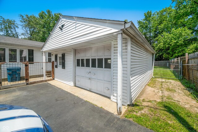 120 Hoss Rd, Indianapolis, IN 46217 - detached garage featuring asphalt driveway