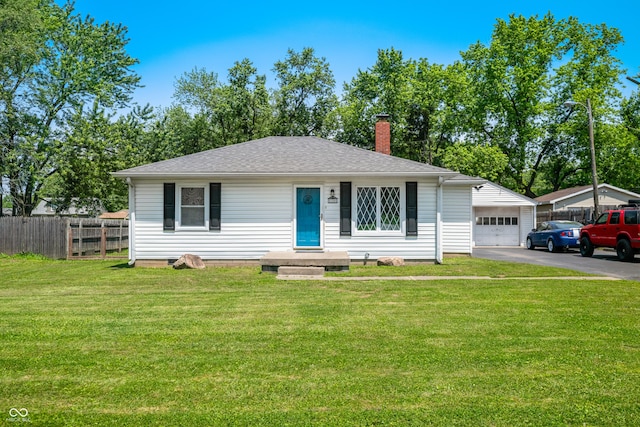 120 Hoss Rd, Indianapolis, IN 46217 - view of front facade with a chimney, asphalt driveway, and a shingled roof