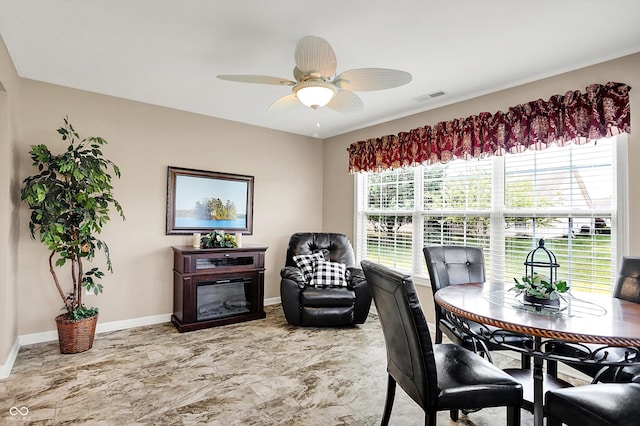 1056 Hilltop Commons Blvd, Whiteland, IN 46184 - office with ceiling fan, baseboards, a glass covered fireplace, and light marble finish floors