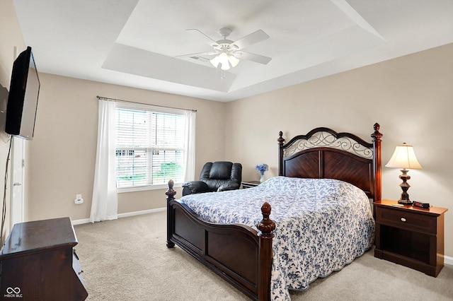 1056 Hilltop Commons Blvd, Whiteland, IN 46184 - bedroom featuring a tray ceiling, light carpet, baseboards, and a ceiling fan