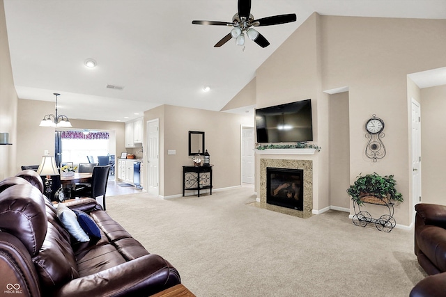 1056 Hilltop Commons Blvd, Whiteland, IN 46184 - living room with light colored carpet, ceiling fan, baseboards, a fireplace, and high vaulted ceiling