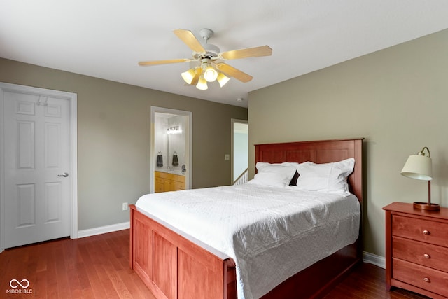 4763 Woods Edge Dr, Zionsville, IN 46077 - bedroom with wood finished floors, ceiling fan, and connected bathroom