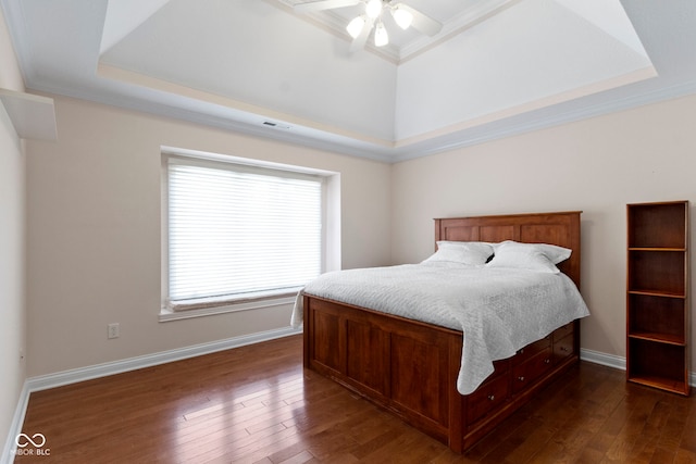 4763 Woods Edge Dr, Zionsville, IN 46077 - bedroom featuring dark wood-style flooring, ornamental molding, a raised ceiling, and a ceiling fan