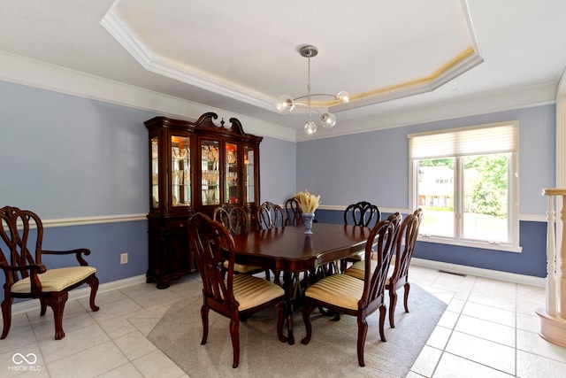 4763 Woods Edge Dr, Zionsville, IN 46077 - dining space with a tray ceiling, light tile patterned floors, crown molding, and a chandelier