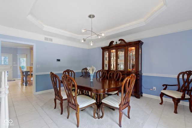 4763 Woods Edge Dr, Zionsville, IN 46077 - dining room with a raised ceiling, crown molding, light tile patterned floors, and a chandelier