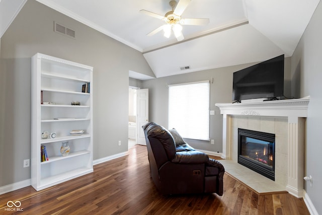 4763 Woods Edge Dr, Zionsville, IN 46077 - living room featuring wood finished floors, a fireplace, lofted ceiling, a ceiling fan, and ornamental molding