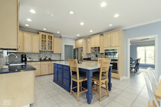 4763 Woods Edge Dr, Zionsville, IN 46077 - kitchen featuring stainless steel appliances, ornamental molding, light brown cabinets, tasteful backsplash, and a center island