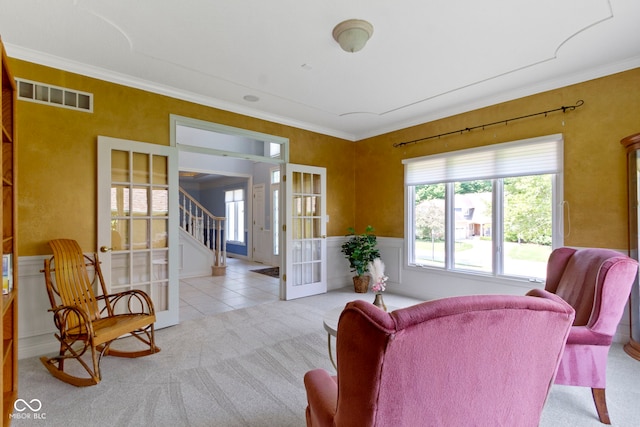 4763 Woods Edge Dr, Zionsville, IN 46077 - living room featuring french doors, carpet, crown molding, stairway, and tile patterned flooring
