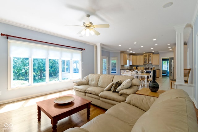 4763 Woods Edge Dr, Zionsville, IN 46077 - living room featuring ornate columns, crown molding, ceiling fan, light wood finished floors, and recessed lighting