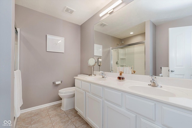 8425 Codesa Way, Indianapolis, IN 46278 - full bathroom with toilet, an enclosed shower, double vanity, and baseboards