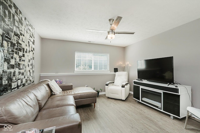8425 Codesa Way, Indianapolis, IN 46278 - living area featuring wood finished floors, ceiling fan, and baseboards