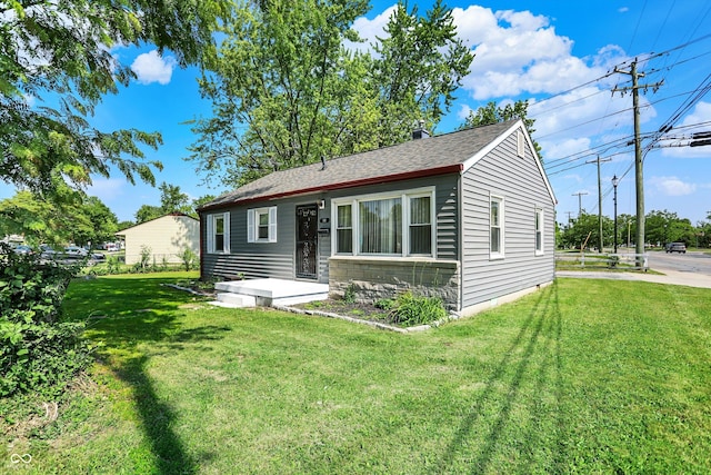 11 14th St, Franklin, IN 46131 - view of front of home with a front yard and roof with shingles