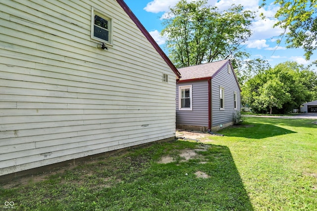 11 14th St, Franklin, IN 46131 - view of side of property with a yard and roof with shingles