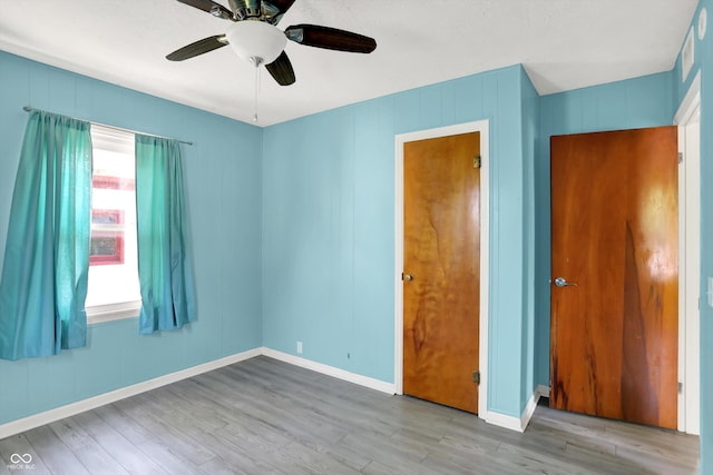 11 14th St, Franklin, IN 46131 - unfurnished bedroom featuring wood finished floors, baseboards, and a ceiling fan