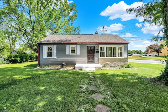 11 14th St, Franklin, IN 46131 - view of front of house featuring a front lawn and roof with shingles