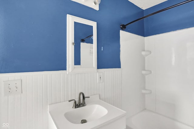 11 14th St, Franklin, IN 46131 - bathroom featuring wainscoting, bathing tub / shower combination, and vanity
