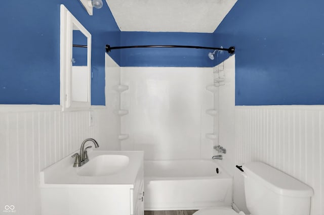11 14th St, Franklin, IN 46131 - bathroom with toilet, a wainscoted wall, bathing tub / shower combination, and vanity