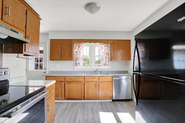 11 14th St, Franklin, IN 46131 - kitchen with stainless steel appliances, under cabinet range hood, and brown cabinets