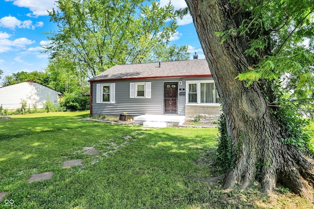11 14th St, Franklin, IN 46131 - view of front of property featuring a front lawn, a chimney, and roof with shingles